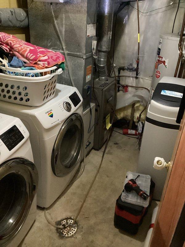 Responded to service call for intermittent water leakage from furnace. Diagnostic inspection revealed broken humidifier spud causing water to leak onto floor. Replaced defective humidifier components, installed new spud, and reconfigured water lines to resolve the issue.