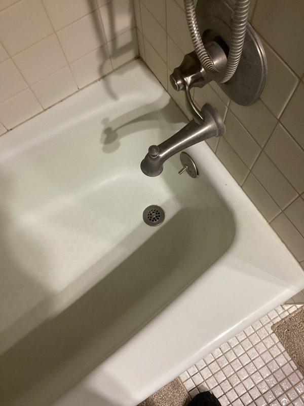 Fixed kitchen sink issues by retrieving knife stuck in drain line and reseating leaking side sprayer (advised customer to contact Moen for warranty replacement parts). Installed new lift and turn drain assembly in hallway tub/shower to address non-functioning drain stopper.