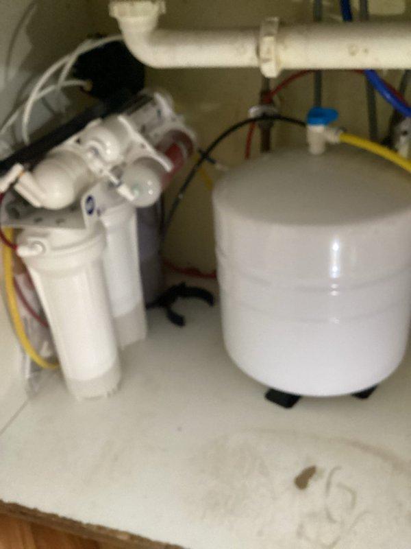 Diagnosed low water pressure issue with customer's iSpring RO system. Inspection revealed resin from the alkaline filter had been released into supply lines, causing significant flow restriction. Advised customer to contact manufacturer regarding warranty coverage for the system.