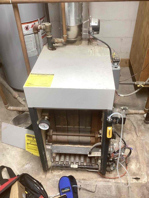 Performed scheduled preventative maintenance on residential gas furnace system. Inspected all components including heat exchanger, copper/PVC piping connections, pressure gauges, and control mechanisms. System is functioning properly with no issues identified.