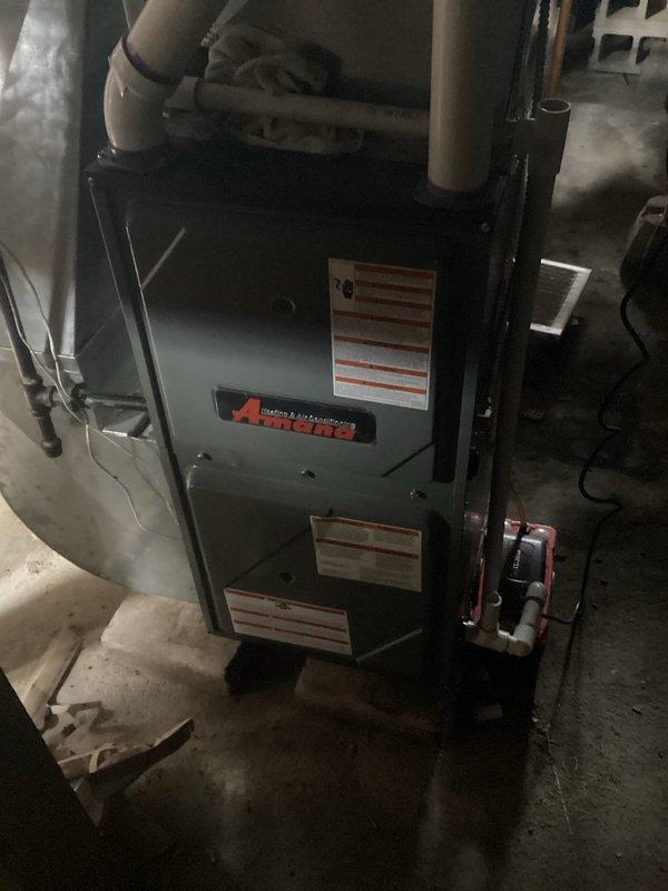 Responded to callback for Amana furnace making loud boom on startup with no heat. Diagnosed issue with dirty burner assembly causing delayed ignition. Performed thorough cleaning of burner components to restore proper ignition sequence and heat output.
