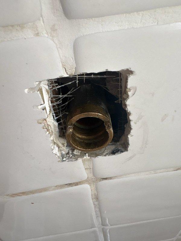 Performed inspection of faulty Moen shower valve with water shut off to the valve only. Documented damage to surrounding tile and access point. Provided estimate for complete shower valve replacement including installation of proper access panel.
