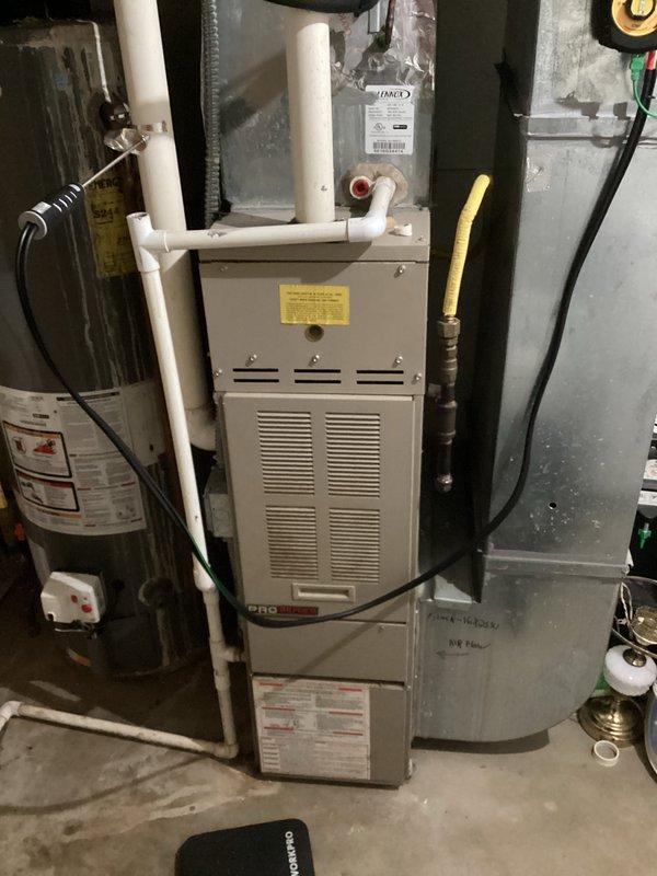 Completed scheduled maintenance on air handler unit. Diagnosed and replaced control board showing burn marks. Cleaned blower wheel to restore proper operation. Documented condition of HVAC system with photos showing installation configuration and component condition.