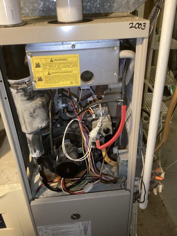 Responded to no-heat service call for 2003 Lennox furnace. Diagnosed failed inducer fan motor in air handler. System was shut down and customer advised of replacement options for either the inducer assembly or complete furnace replacement due to unit age.
