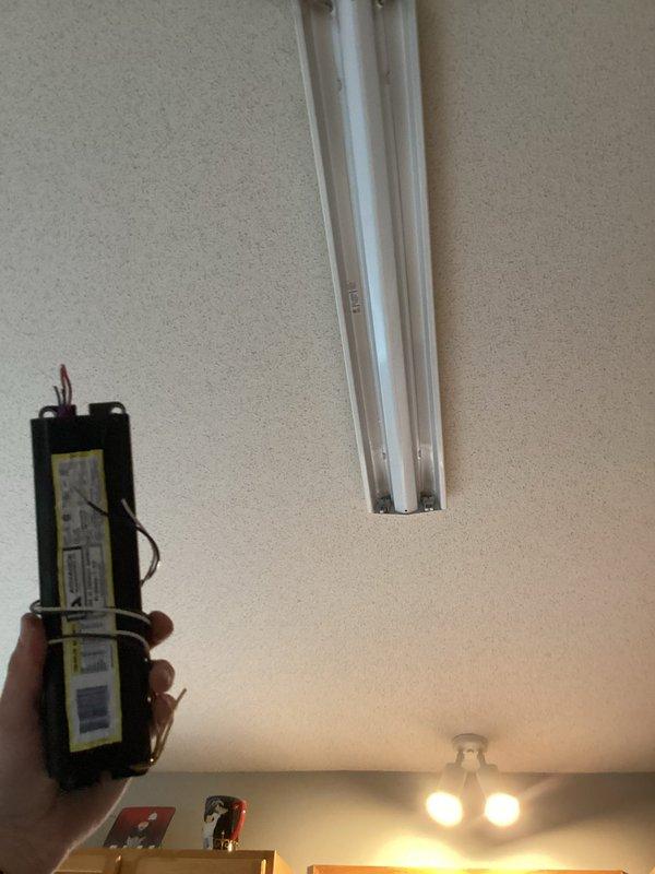 Diagnosed and repaired non-functioning kitchen overhead light fixture by identifying a failed ballast. Bypassed the defective ballast and installed new fluorescent tubes, successfully restoring proper illumination to the kitchen ceiling fixture.
