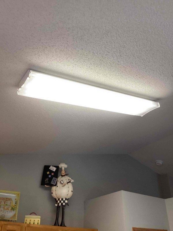 Diagnosed and repaired non-functioning kitchen overhead light fixture by identifying a failed ballast. Bypassed the defective ballast and installed new fluorescent tubes, successfully restoring proper illumination to the kitchen ceiling fixture.
