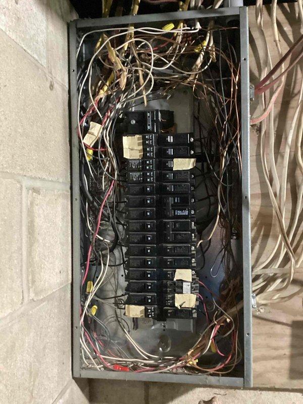 Responded to callback for previously installed outlet near TV/fireplace that was tripping customer's surge protector. Investigation revealed touching wires causing the issue. Removed outlet, verified all connections, applied electrical tape to terminals and conductors to prevent unintended contact, and reinstalled the outlet to restore proper function.