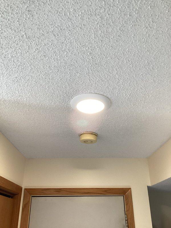 Responded to service call for non-functioning ceiling light fixture. Upon inspection, discovered broken lamp holder wires. Replaced fixture with new disk light, restoring proper illumination to the area. Verified proper operation before completing service.