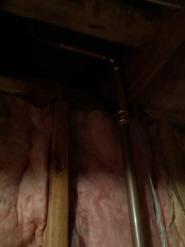 Responded to leak in basement and discovered pin hole leak on 1" copper mainline. Removed damaged section of copper pipe, replaced with new copper section, and installed a new 1" ball valve on the mainline to provide proper shut-off capability after the water meter.