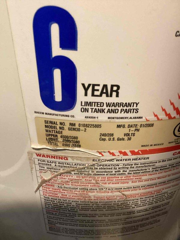 Successfully completed removal of old Impression water softener system from utility room as requested, requiring additional assistance due to equipment size. Also documented existing Rheem 30-gallon electric water heater (Model 6EM30-2, manufactured 01/2008) with 6-year limited warranty for reference.