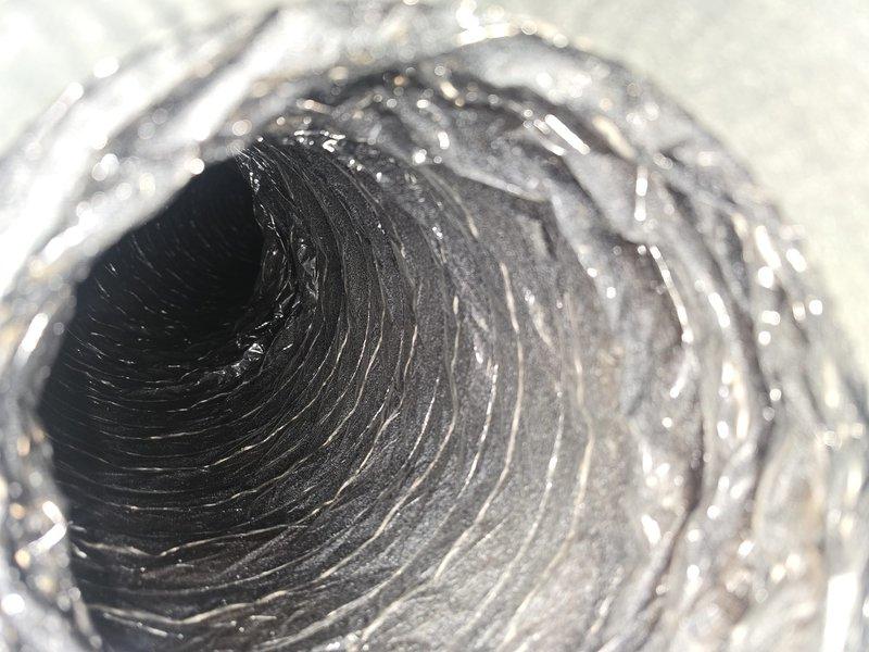 Completed comprehensive duct cleaning service throughout the HVAC system, including thorough cleaning of all supply and return vents. Additionally, performed dryer vent cleaning to remove lint accumulation and improve system efficiency. Post-cleaning inspection confirmed successful removal of dust and debris from the flexible ducting, with photographic documentation showing clean, intact spiral ribbed ductwork with no damage or required repairs.