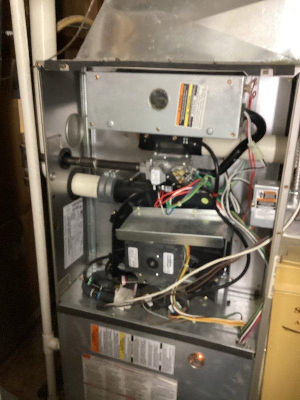 Performed scheduled preventative maintenance on air handler system. Discovered plugged secondary drain line which was cleared. Furnace was red tagged due to safety concerns identified during inspection.