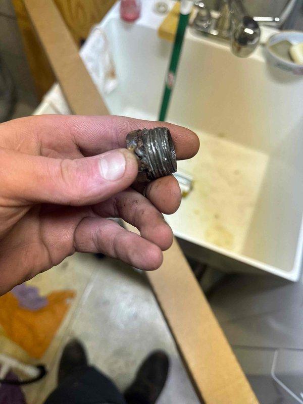 Responded to service call for leaking water heater. Diagnosed leak originating from cross-threaded anode rod inlet. Successfully replaced anode rod, resolving the leak issue.