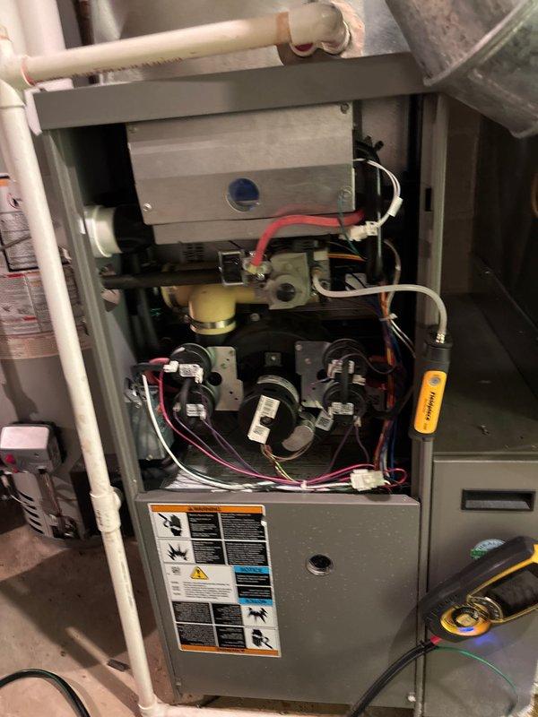 Performed scheduled maintenance agreement tune-up on residential HVAC system. Inspected furnace components including heat exchanger, electrical connections, and blower assembly, confirming proper operation. Also examined water heater and associated plumbing system with no issues identified; all systems functioning correctly after service.