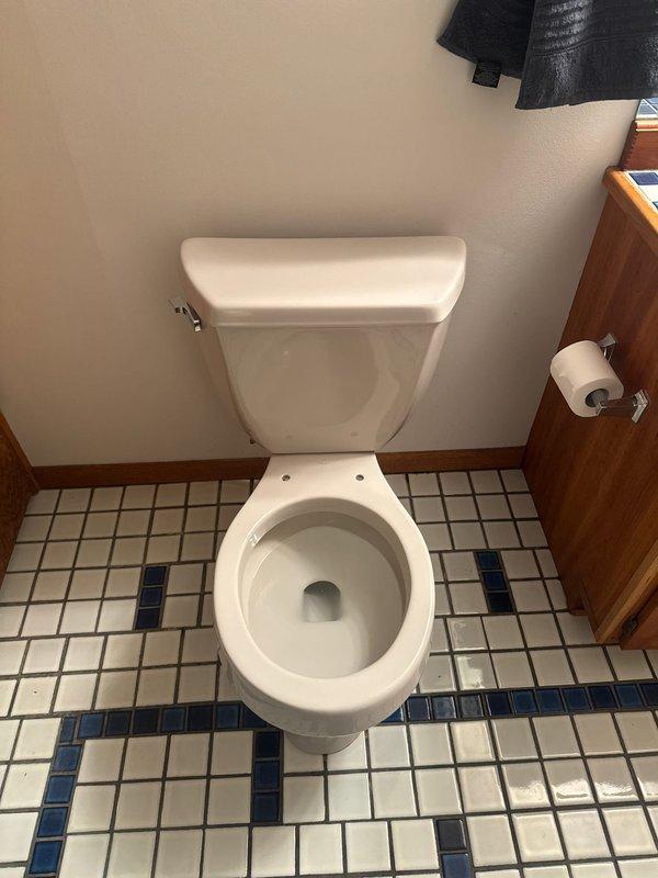 Diagnosed and repaired toilet leaking at base by replacing damaged wax ring seal. Completed installation of new wax seal to restore proper function and eliminate leakage from base of toilet.