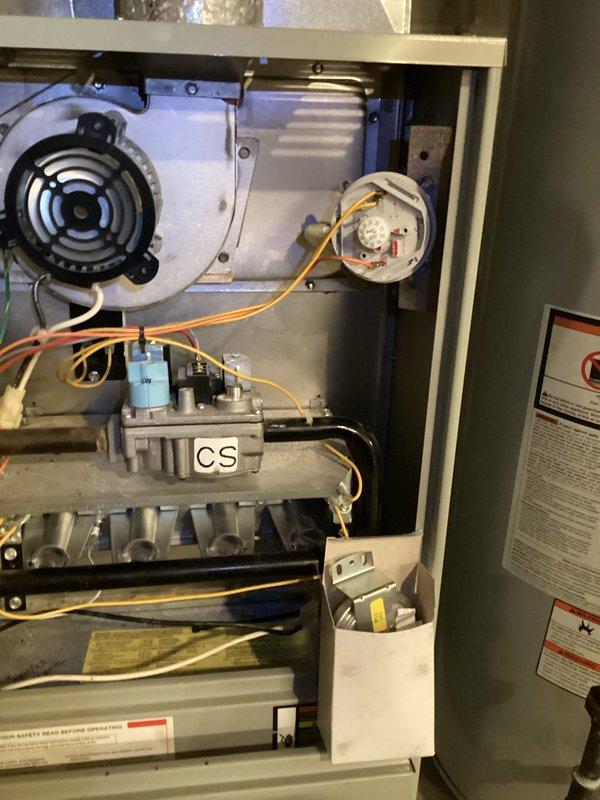Responded to service call for intermittently functioning furnace that was failing to light and cycling repeatedly. Upon inspection, identified dirty flame sensor and faulty pressure switch as root causes. Performed maintenance by cleaning flame sensor and replaced pressure switch, restoring proper operation of the heating system.