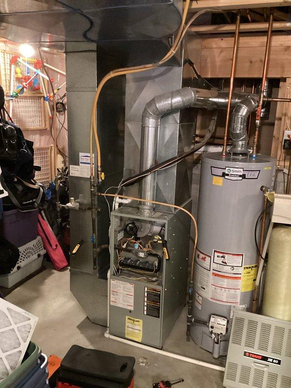 Responded to service call for intermittently functioning furnace that was failing to light and cycling repeatedly. Upon inspection, identified dirty flame sensor and faulty pressure switch as root causes. Performed maintenance by cleaning flame sensor and replaced pressure switch, restoring proper operation of the heating system.