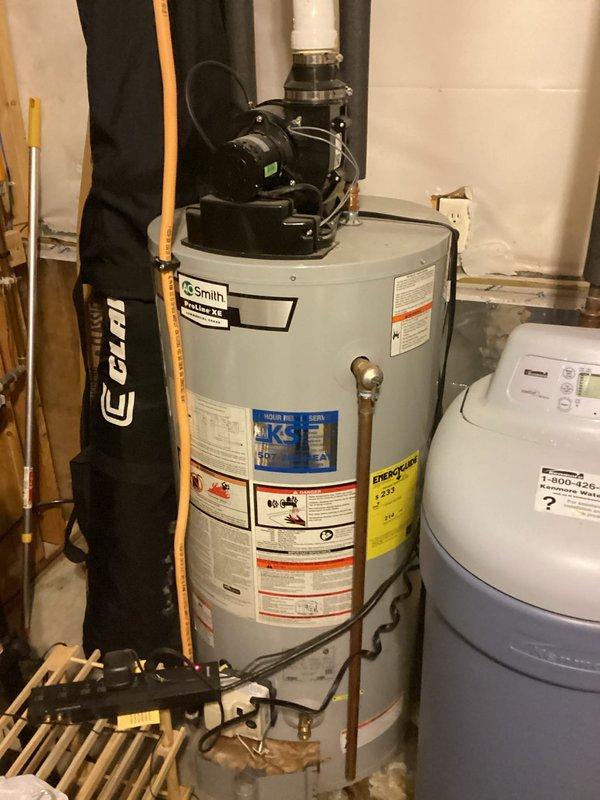 Diagnosed 7-year-old A.O. Smith 40-gallon power vent water heater with internal tank leak. Verified unit is leaking from bottom and confirmed it is a non-repairable tank breach. Informed that complete replacement is required as unit is manufactured in 2017 and outside warranty period.