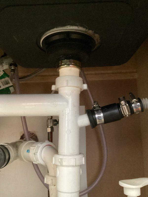 Arrived to address reported leak under kitchen sink. Diagnosed issue as a leaking basket strainer at the nut connection. Successfully repaired by installing new nut on the basket strainer assembly, resolving the leak.