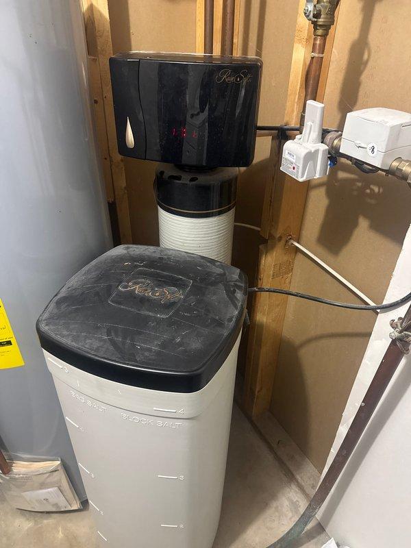 Upon arrival, diagnosed RainSoft Gold series water softener displaying 1b error code, indicating a seized piston. After thorough inspection of the system components and control panel, determined the unit requires complete replacement. Provided customer with estimate for new system installation.