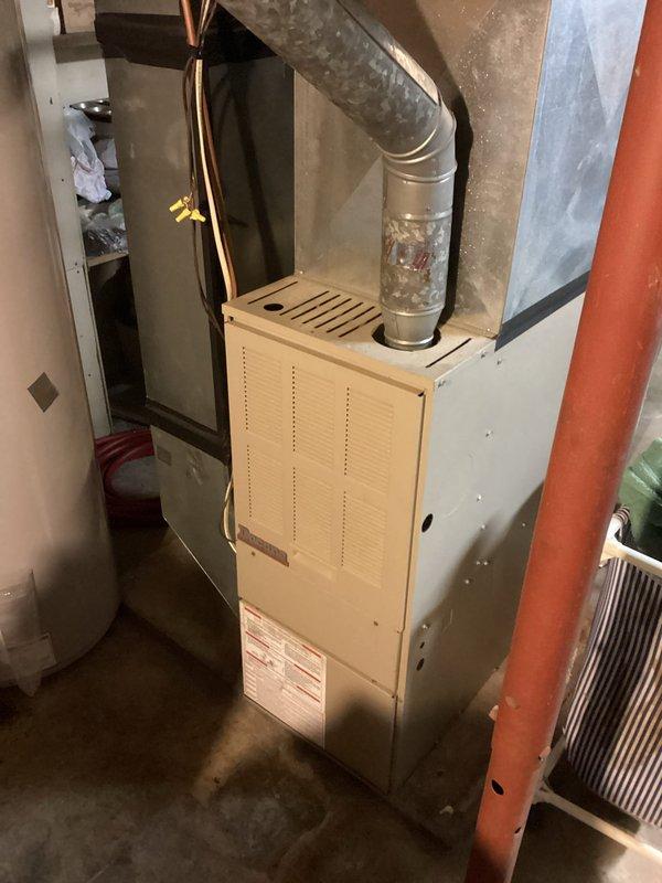 Responded to no-heat call for aging furnace system. Upon inspection, identified system was operational with proper flame pattern visible at burner assembly. Customer was unable to identify issue during initial troubleshooting; verified all components functioning correctly including blower motor and gas ignition. Provided basic system operation instructions and recommended customer monitor performance.