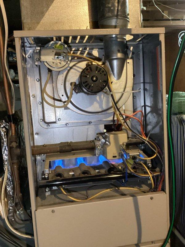 Responded to no-heat call for aging furnace system. Upon inspection, identified system was operational with proper flame pattern visible at burner assembly. Customer was unable to identify issue during initial troubleshooting; verified all components functioning correctly including blower motor and gas ignition. Provided basic system operation instructions and recommended customer monitor performance.