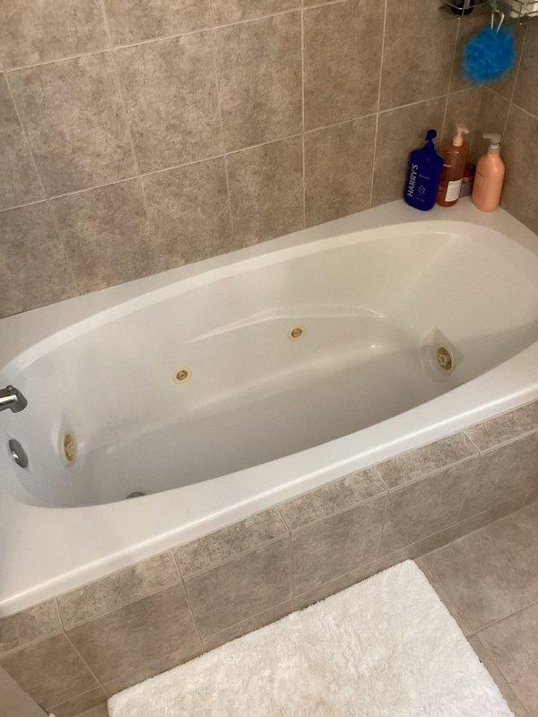 Responded to service call for non-functioning jacuzzi tub. Diagnosed issue as tripped GFCI outlet in access area. Reset GFCI and verified proper electrical connections at both switch and outlet locations, restoring functionality to jacuzzi tub.
