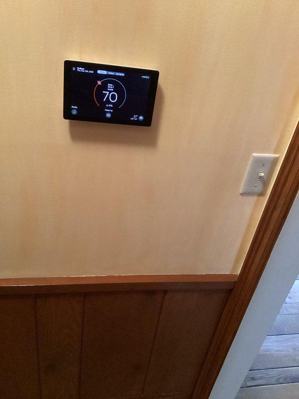 Arrived on site and evaluated wiring requirements for thermostat to zone control system. Provided estimate for running two 18-2 wires to S40 location, noting installation complexity due to extensive ductwork. Recommended pull string method prior to wire installation to navigate structural obstacles.