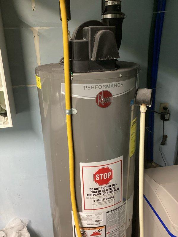 Diagnosed and repaired an 11-year-old Rheem Performance water heater that was slowly losing hot water capacity. Found heat sensor wire disconnected from terminal which prevented proper temperature regulation, and reattached it to restore normal operation. Advised customer about likely sediment buildup in tank contributing to reduced heating efficiency and recommended tank flushing to improve performance.