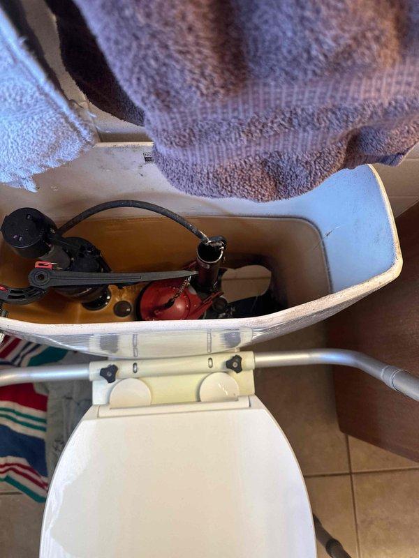 Responded to emergency call for severely leaking toilet. Inspection revealed toilet tank shattered at base, requiring water to be shut off. Provided customer with replacement toilet quote, but customer declined service and indicated family member would complete the replacement.