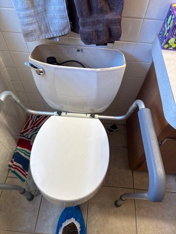 Responded to emergency call for severely leaking toilet. Inspection revealed toilet tank shattered at base, requiring water to be shut off. Provided customer with replacement toilet quote, but customer declined service and indicated family member would complete the replacement.