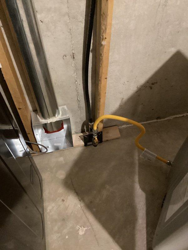 Returned to property to complete gas dryer installation by properly connecting the exhaust ductwork. Installed flexible aluminum ducting from dryer outlet to wall vent, ensuring secure connections at both ends. Verified proper gas line connection and tested system for proper operation before completing service call.