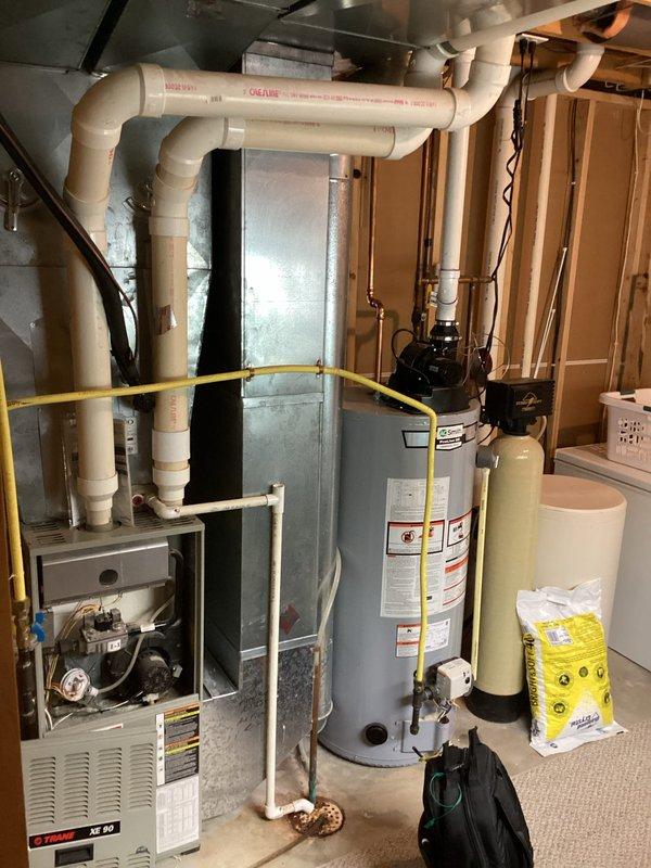 Performed comprehensive furnace tune-up on Goodman system located in basement mechanical room. Inspected all components including gas connections, PVC venting, and control board for proper operation. System is functioning within manufacturer specifications with no immediate concerns noted.