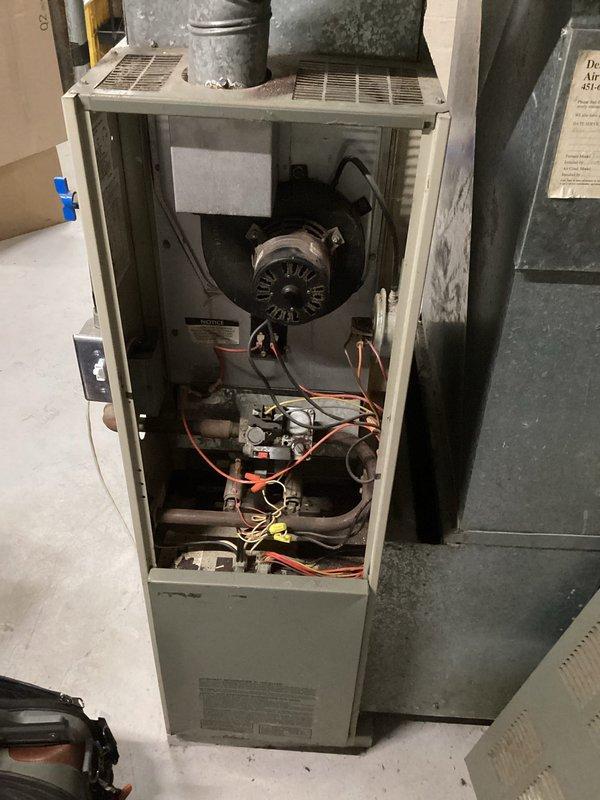 Diagnosed no heat complaint in furnace with intermittent operation. Found pressure switch failing to close due to plugged port on inducer motor. Cleared obstructed port and replaced hoses, restoring proper pressure switch operation and normal heating function. Verified system operation with temperature reading of 101.1°F.