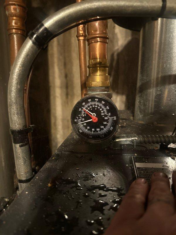 Responded to no heat complaint for boiler system. Diagnosed low water pressure as shown on system gauge. Restored proper operation by refilling system and bleeding air from radiators.