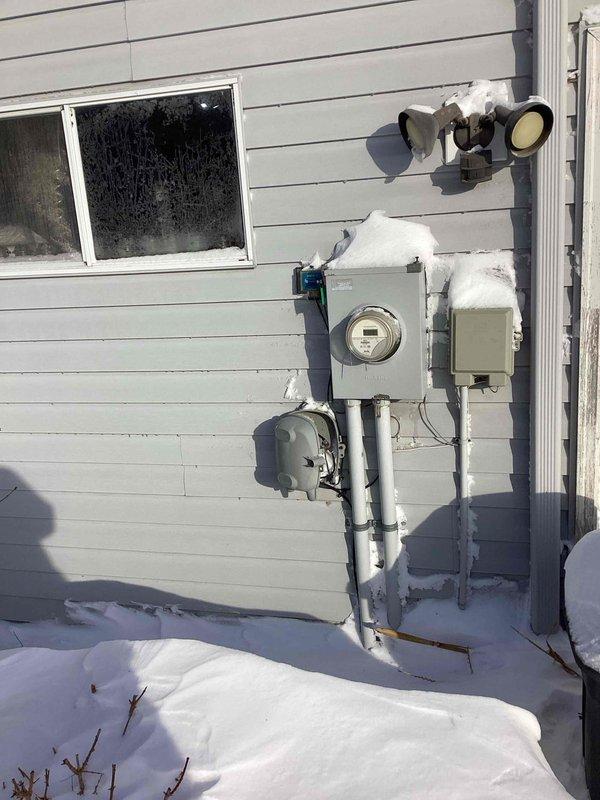 Performed electrical inspection of residential property with scheduled 8-12 arrival window. Identified washing machine outlet requiring GFCI protection per code requirements. Documented electrical meter installation and noted potential moisture exposure risk to exterior electrical components due to snow accumulation. Provided customer with estimate for necessary upgrades.