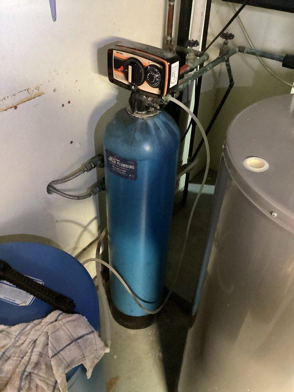 Conducted an on-site estimate for replacement of existing water heater and water softener system. Inspected current installation, noting the JCS Plumbing-branded water softener with electronic control head and associated plumbing connections. Documented the condition of the existing equipment, including visible oxidation on some copper pipes, and prepared comprehensive replacement options. Quote for both units was emailed to customer with membership and non-membership pricing options as requested.