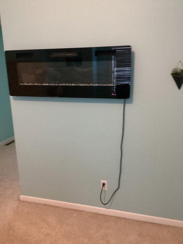 Relocated three outlets to accommodate TV installation and electric fireplace positioning. Replaced faulty dimmer switch in dining room with new compatible unit. Tested all modified circuits to verify proper operation and safe installation according to electrical code requirements.