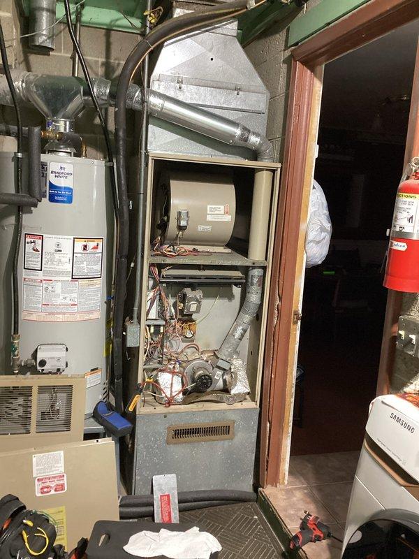 Responded to no-heat call for furnace less than 10 years old. Diagnosed tripped limit switch in blower compartment due to excessive gas pressure. Corrected issue by adjusting gas pressure downward and resetting limit switch, restoring normal heating operation.