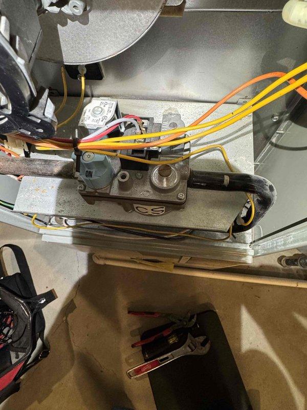 Responded to a callback for a furnace not producing heat. Diagnosed intermittent operation caused by a sticking gas valve. Previous repair was unsuccessful. Replaced gas valve, restoring proper system operation and heat production.