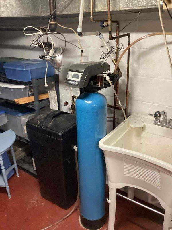 Conducted comprehensive plumbing inspection of residence, finding all systems in good working condition. Verified 40-gallon atmospheric vent water heater (A.O. Smith, installed 2014) operating properly, and confirmed Superior brand water softener functioning effectively with hardness testing at 2 ppm. No plumbing issues were identified throughout the property.
