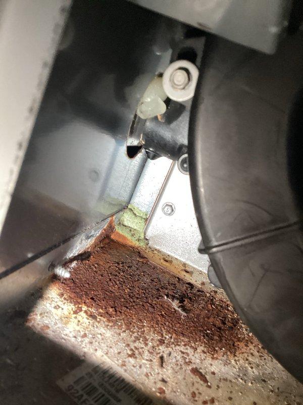 Responded to no heat call, diagnosed failed inducer motor and leaking collector box in aging furnace system. Visual inspection revealed significant corrosion and moisture damage in the heat exchanger area. Replaced inducer motor assembly and collector box, restoring proper system operation and eliminating grinding noise that was previously reported.