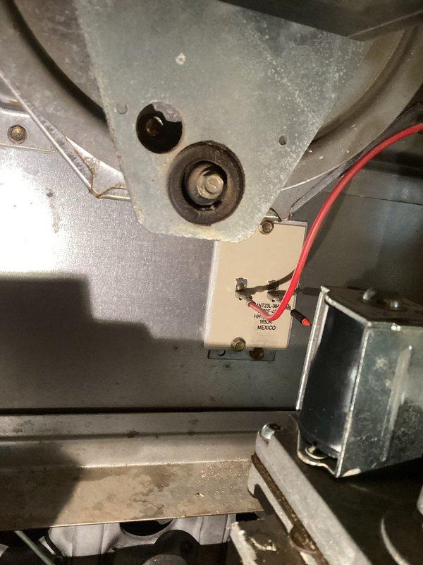 Responded to no-heat call where system was running fan but not producing heat due to pilot issues. Diagnosed high limit switch stuck in open position. Replaced faulty limit switch which restored proper heating function.