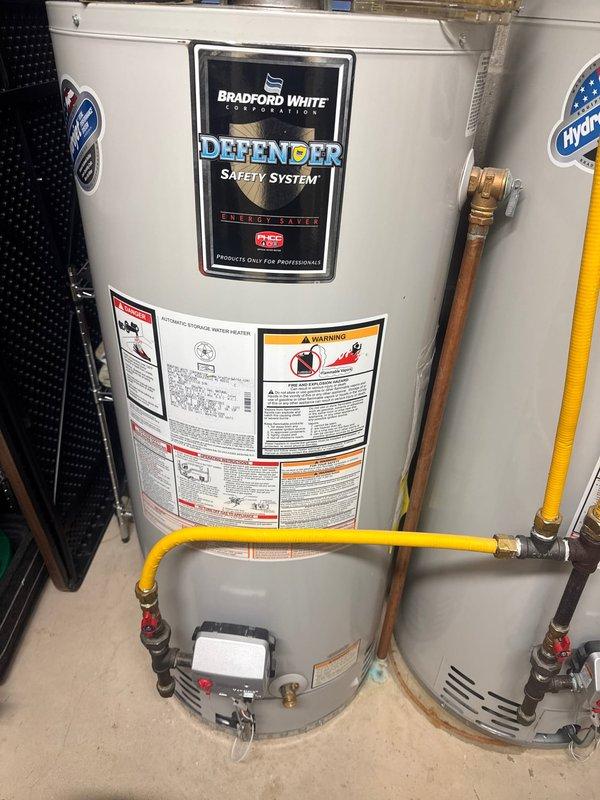 Diagnosed zone heating issue and identified sunroom zone damper stuck in closed position. Replaced #4 zone damper for sunroom to restore proper zoning function. Inspected Bradford White water heater with customer complaint of insufficient hot water; unit appears to be in normal operating condition with no visible leaks or damage.