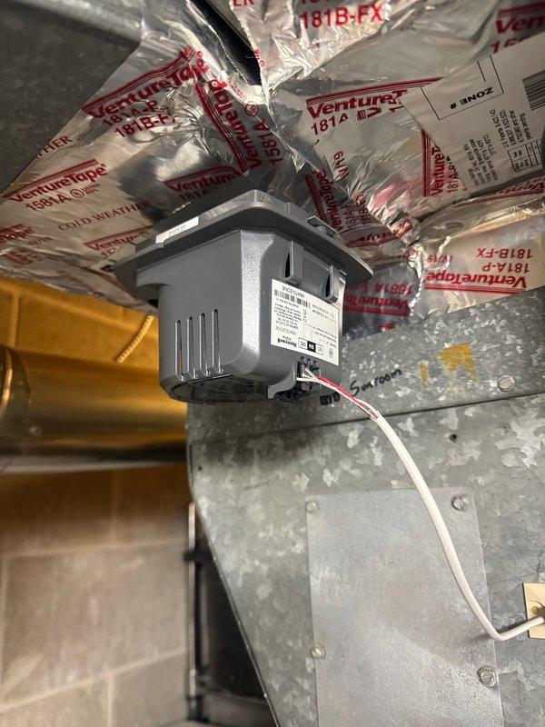 Diagnosed zone heating issue and identified sunroom zone damper stuck in closed position. Replaced #4 zone damper for sunroom to restore proper zoning function. Inspected Bradford White water heater with customer complaint of insufficient hot water; unit appears to be in normal operating condition with no visible leaks or damage.