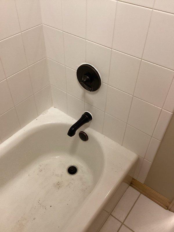 Responded to a call back for a leaking shower valve. Accessed the valve through the downstairs bathroom ceiling, removed the 20-year-old American Standard fixture (for which replacement parts were unavailable due to age), and installed customer-provided Delta shower valve. Made all necessary connections, restored water service, and verified proper operation.