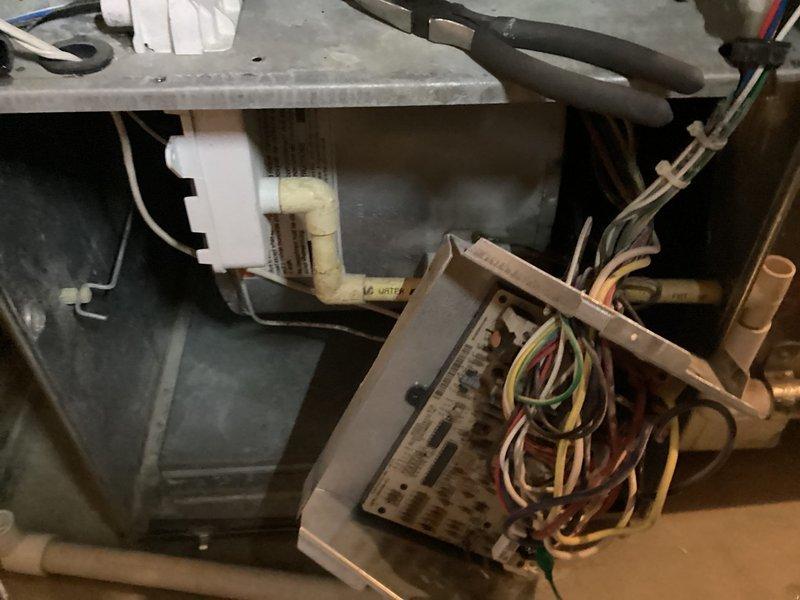 Diagnosed Carrier furnace failure caused by heat exchanger burnout due to improper humidifier use with inadequate filtration. Inspected electrical control board and internal components to confirm diagnosis. Recommended complete system replacement due to age of unit (10+ years) and connected customer with project manager to discuss replacement options.