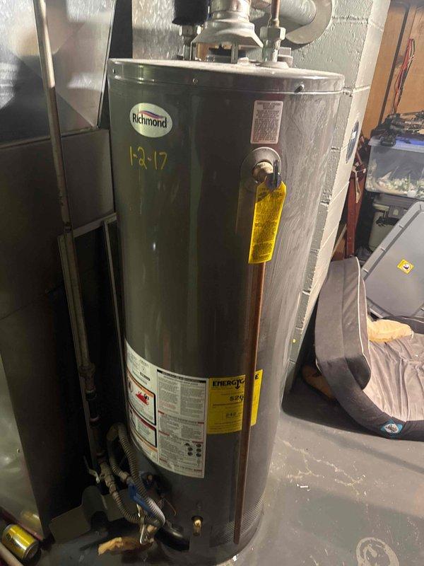 Responded to emergency call for basement flooding originating from a failed Richmond water heater. Upon inspection, identified active leak from the tank requiring immediate attention. Deployed sump pump to mitigate water damage, then provided customer with replacement water heater estimate after confirming unit (installed 1-2-17) was beyond repair.