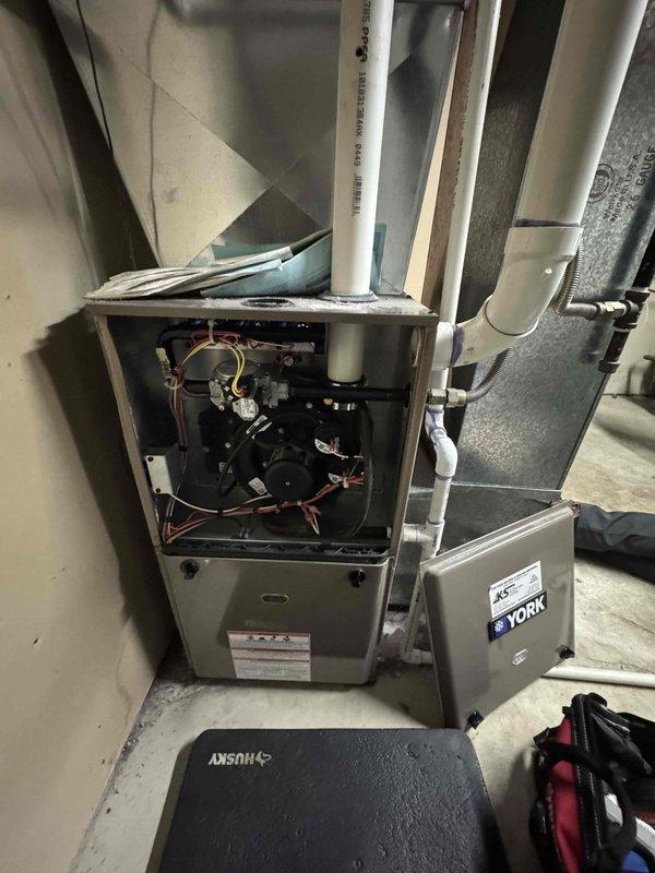 Completed prepaid maintenance service on York furnace. Performed comprehensive system inspection and combustion analysis, confirming proper operation with readings of CO (14F), CO₂ (18%), O₂ (8.7%), efficiency loss (11.2%), and excess air (26.7%). Replaced filter as part of the scheduled tune-up service.