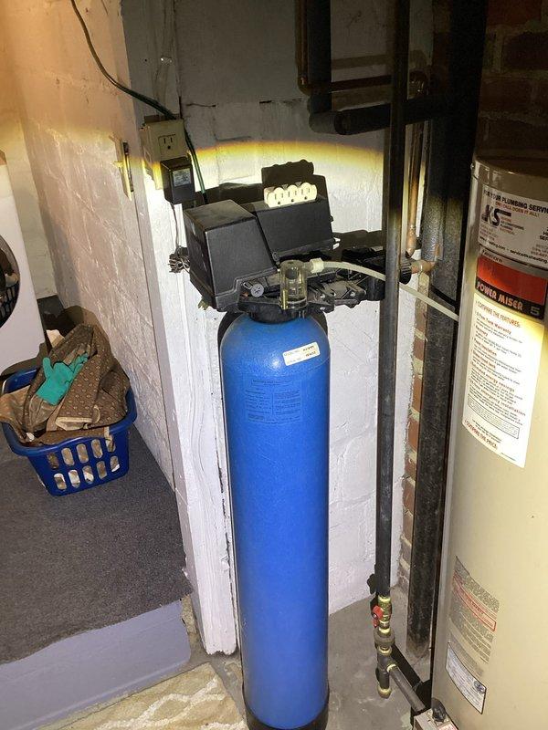 Performed comprehensive plumbing inspection of residential property, examining all plumbing components for functionality. Inspected 1979 water heater which is operating efficiently despite age, and tested water softener which demonstrated optimal performance with 2 ppm hardness level. All other plumbing systems and fixtures throughout the home were verified to be in proper working condition.